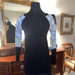 3/4 sleeve knit shirt. Black, gray and white. Plaid sleeves. Small fits Medium.
